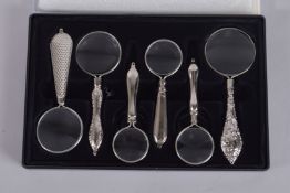 A BOX OF SIX SMALL MAGNIFYING GLASSES.