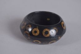 A KENNETH LANE VINTAGE BRACELET WITH CIRCLES, signed, 4ins diameter.