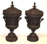 A PAIR OF IRISH CARVED WOOD URNS AND COVERS. 3ft high.