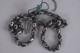 AN ISLAMIC SILVERED BEAD NECKLACE. 24ins long