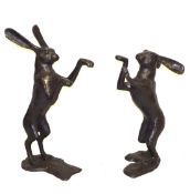 A LARGE PAIR OF BRONZE BOXING HARES. 2ft 10ins high and 2ft 7ins high.