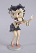 A PAINTED CAST IRON BETTY BOOP on a circular base. 12ins high.