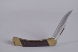 A VICTORINOX 970 PUMA GAME WARDEN FOLDING KNIFE with leather case.