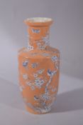 A CHINESE CORAL RED GROUND CRACKLE GLAZE PORCELAIN VASE. 26cms high.