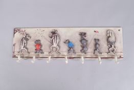 A PAINTED CAST IRON DOG COAT HOOK. 23ins long.