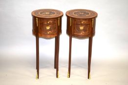 A PAIR OF LOUIS XVI DESIGN CIRCULAR INLAID BEDSIDE TABLES with three drawers, on slender curving