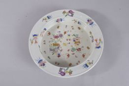 A CHINESE POLYCHROME PORCELAIN DISH. 31cms diameter.