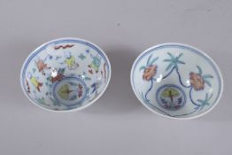 TWO CHINESE WUCAI PORCELAIN TEACUPS. 9cms diameter each.