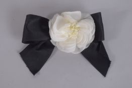 A CHANEL BOW FLOWER BROOCH.