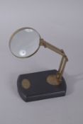 A MAGNIFYING GLASS on a stand. 10ins high.