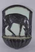 AN ART DECO LARGE POTTERY WALL POCKET, modelled as a deer at a watering hole. 2ft 0ins high x 1ft