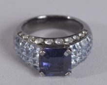 AN 18CT SAPPHIRE AND DIAMOND RING