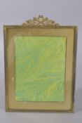 A LARGE EMPIRE ORMOLU PHOTOGRAPH FRAME. 11.5ins high x 8.5ins wide.