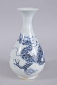 A CHINESE BLUE AND WHITE PORCELAIN YUHUCHUNPIN DRAGON VASE. 29cms high.