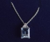 AN 18CT GOLD OCTAGONAL AQUAMARINE AND DIAMOND PENDANT,
