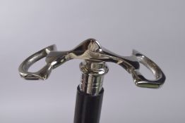 A WALKING STICK WITH SNAFFLE HANDLE.