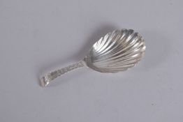 A GEORGE III SILVER SKULL CADDY SPOON