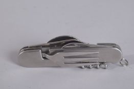 A LEOPOLD FOLDING KNIFE with fork and spoon.