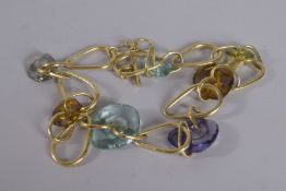 A SILVER HARDSTONE AND GILT NECKLACE.