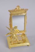 A GOOD GILT BRONZE CHERUB MIRROR. 9ins high.