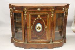 A GOOD VICTORIAN WALNUT CREDENZA with painted Sevres panels. The front with a single panel door, the