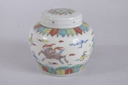 A CHINESE WUCAI PORCELAIN GINGER JAR AND COVER. 12.5cms high.