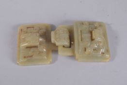 A CHINESE JADE BUCKLE, in two parts.