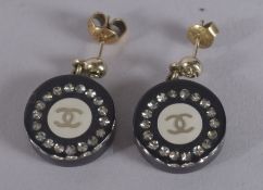 A PAIR OF CHANEL BLACK DOUBLE C EARRINGS