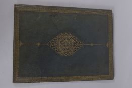 A GILT TOOLED GREEN LEATHER FOLIO. 16ins x 12ins.