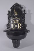 A CAST IRON WALL FOUNTAIN, E.R. II. 27ins high.