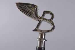 A WALKING STICK WITH FLYING B HANDLE.