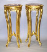 A PAIR OF LOUIS XVI STYLE GILT MARBLE TOP STANDS on four curving legs. 3ft 8ins high x 1ft 7ins