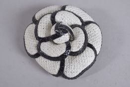 A CHANEL FLOWER BROOCH. Chanel label, Made in France.