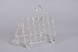 A SILVER PLATED, FOX HUNTING, SIX DIVISION TOAST RACK.