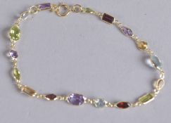 AN 18CT GOLD MULTI GEM BRACELET.