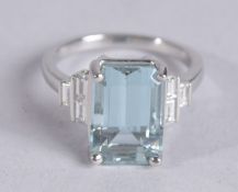 A PLATINUM AQUAMARINE AND DIAMOND RING.
