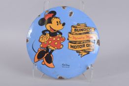 A DISNEY CIRCULAR ENAMEL SIGN, 'SUNOCO MOTOR OIL'. 12ins diameter.