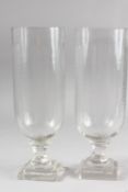 A GOOD PAIR OF GLASS HURRICANE LAMPS. 13.5ins high.