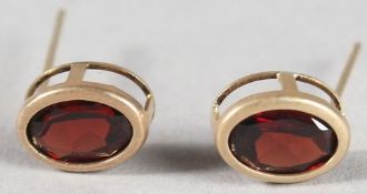 A PAIR OF 9CT GOLD GARNET EARRINGS