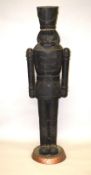 A LARGE CARVED NUTCRACKER FIGURE. 6ft high.