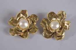A PAIR OF YVES ST. LAURENT GILT METAL FLOWER EAR CLIPS Signed.