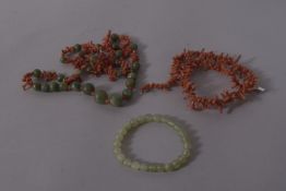 ASSORTED JADITE AND CORAL NECKLACES.