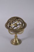 A BRASS ASTRO GLOBE. 10ins high.