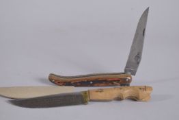 A LAGUIOLE FOLDING KNIFE,HS003,with skull, and AN INOX KNIFE. (2).