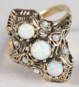 A 9CT GOLD OPAL SET RING.