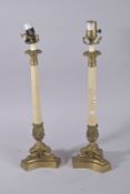 A PAIR OF FAUX MARBLE COLUMN AND GILT METAL LAMPS. 18ins high.