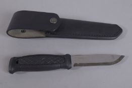 A MORAKNIV SWEDISH KNIFE in a leather case. 9ins