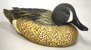 A RARE CARVED WOOD AND PAINTED DECOY DUCK by BENJAMIN SCUMIAT AND BEN HEINEMANN. Etched signature on