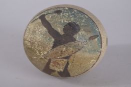 AN OSTRICH EGG CARVED AND PAINTED WITH A ZULU WARRIOR.