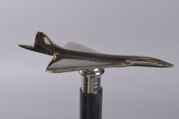 A WALKING STICK WITH CONCORDE HANDLE.